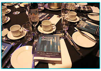 Table at the Yorkshire Financial Awards evening, with programme