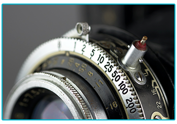 Film photography - reasons to go analogue - close up of manual camera zoom