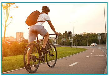 Stay safe while cycling to work - man in shorts cycles to work