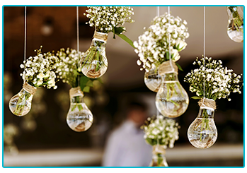 wedding trends - pretty bouquets of flowers suspended in used light bulbs 
