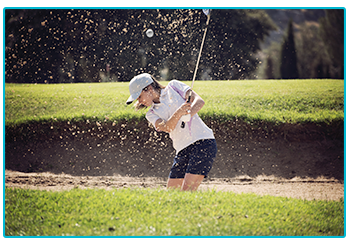 golf trends 2020 - female golfer takes a shot in a bunker
