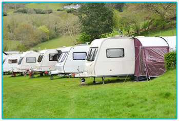 New Touring Caravans - touring caravans in a row on campsite