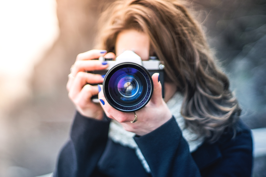 photography news woman taking photo with camera