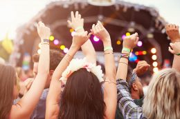 audience with hands in the air at a music festival