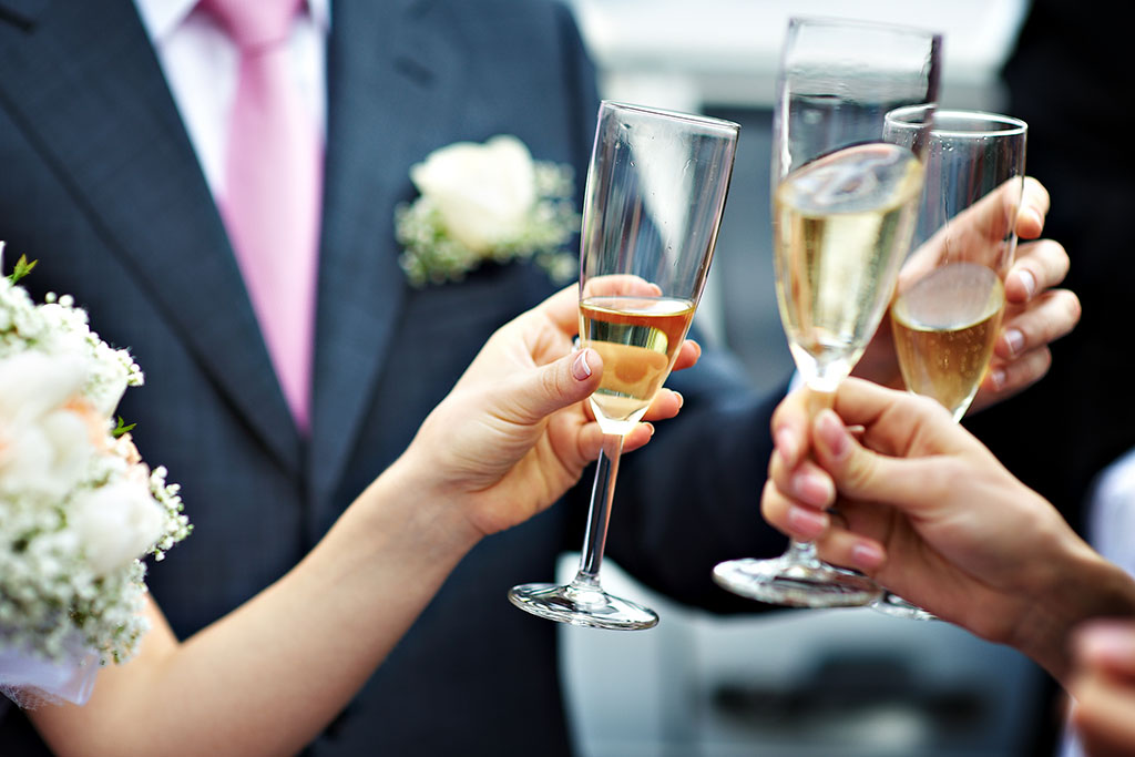 people toasting sparkling wine at a wedding 