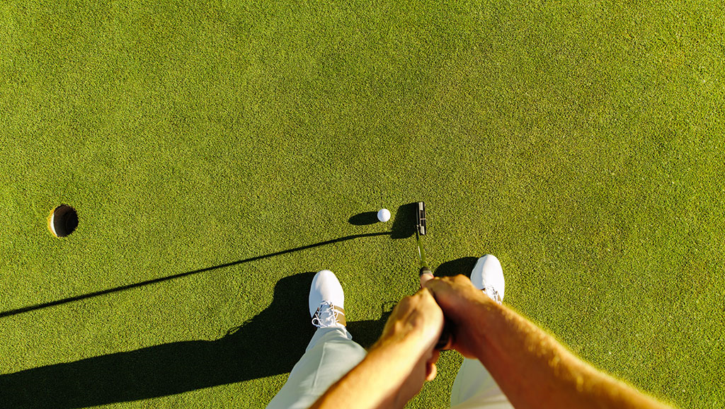 birds eye view of a golfer putting 