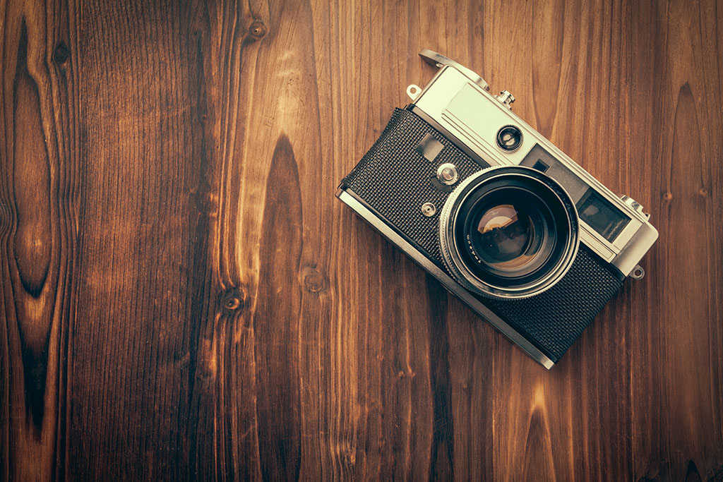 retro camera with a wooden background 