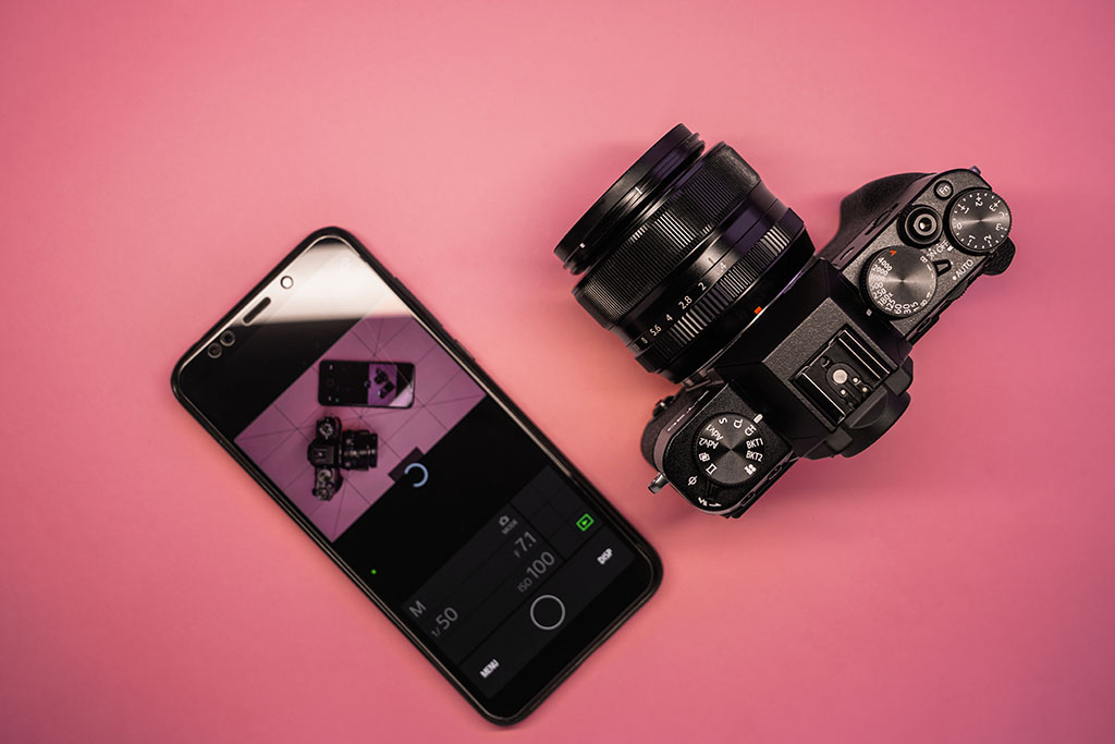 sky view of a dslr camera and smart phone