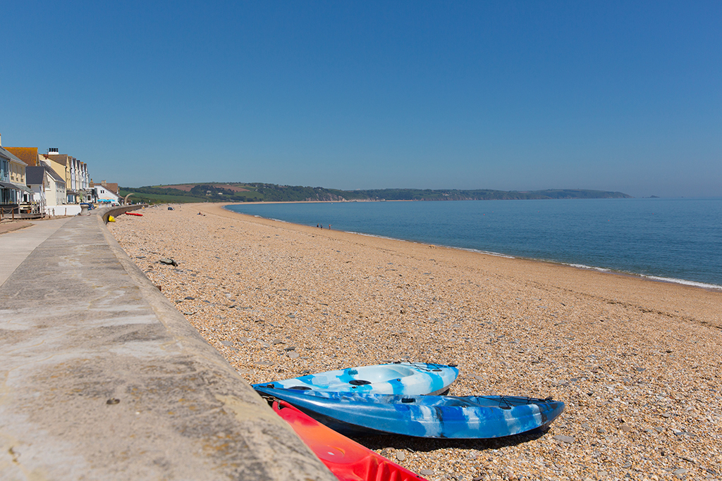 Slapton Sands beach near Torcross Devon England UK with canoes