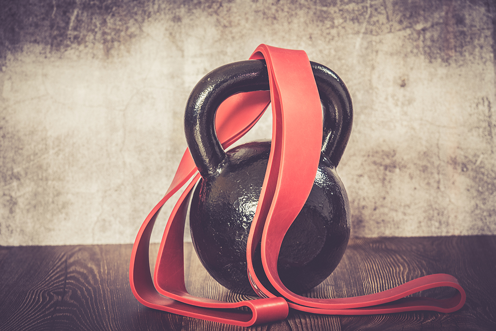 Black kettlebell and dumbbells with free weights