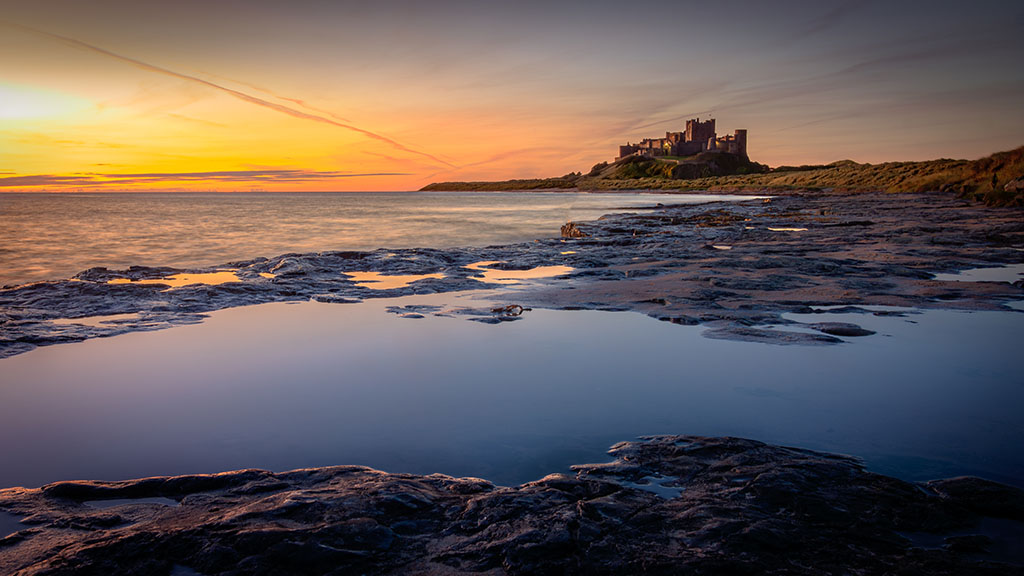 Best Campsites UK Northumberland Castle At Sunrise.