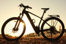 Electric bike silhouette at sunset.
