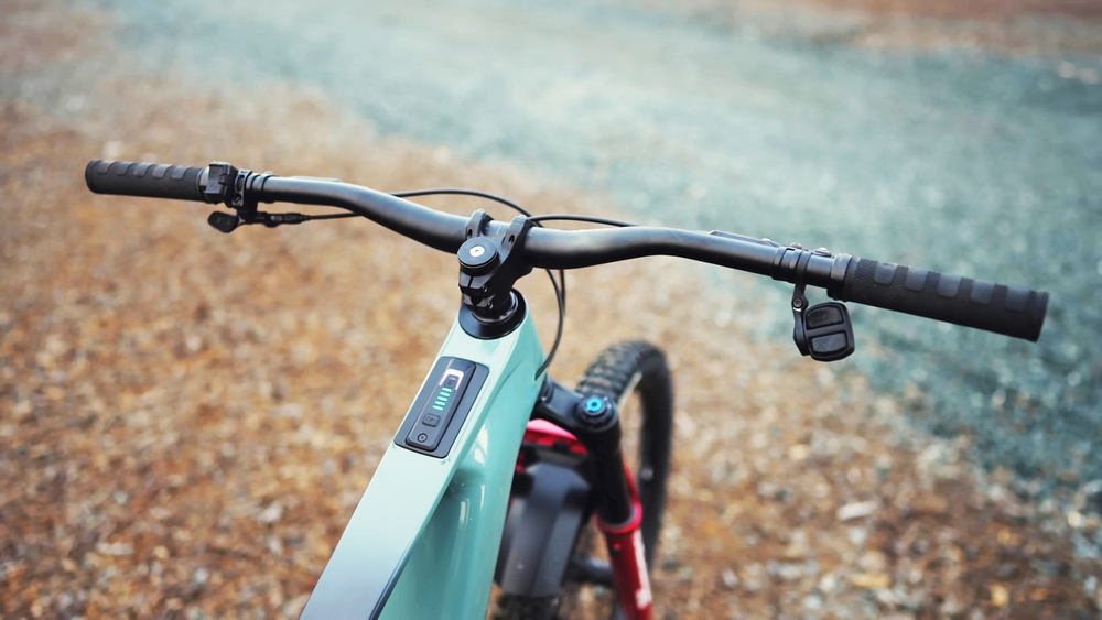 Electric bike stationary on gravel road.