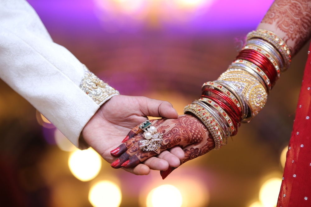 Close-up Shot Pakistani-Indian Bride Groom Holding Hands.