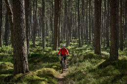 Woman riding her mountain bike in Scotland.