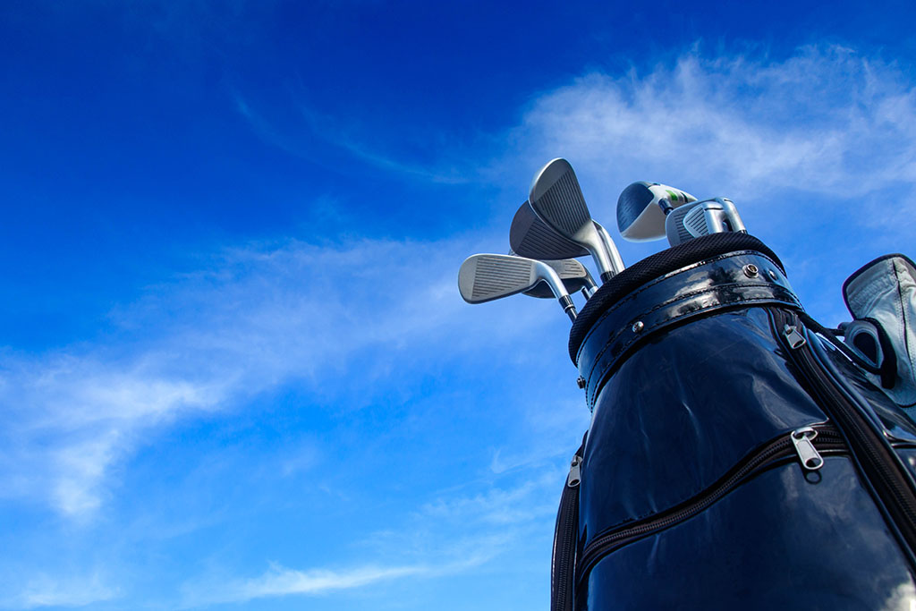 best golf brands golf bag with blue sky above.